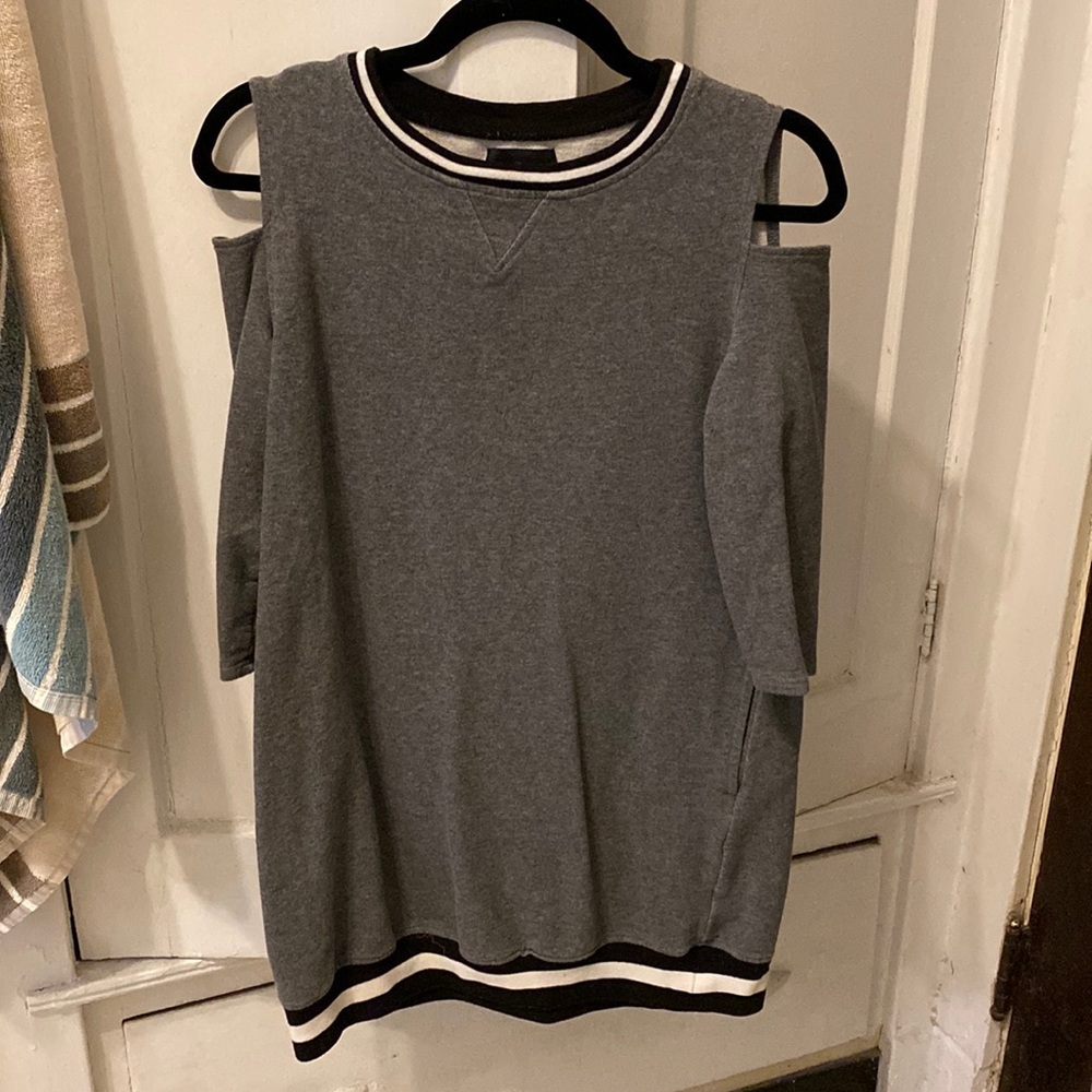 Cap sleeve sweatshirt dress with elastic band on the bottom.